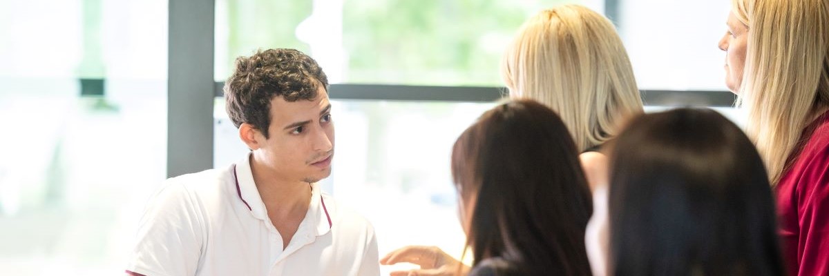 Migration Services staff members helping a skilled migrant at the Construction Connect Employment Expo.