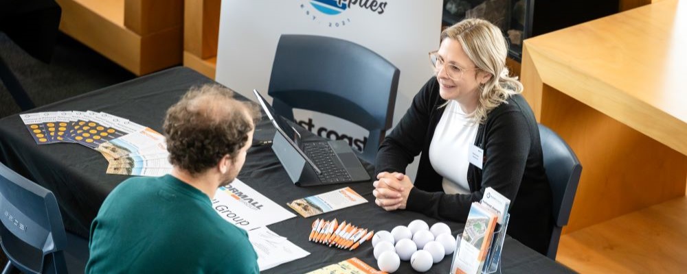 Pictured: WA employer connects with skilled migrant at the Construction Connect Employment Expo.