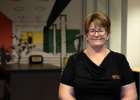 Jeanie Patrick, Office Manager standing in her office at Mandurah Painting and Decorating