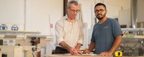 Two people working in a workshop